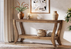 Wooden console table with decorative items in a warm-toned indoor setting