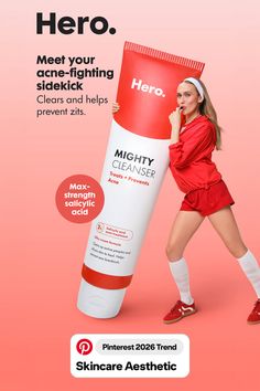 Woman in red athletic wear holding a large tube of Mighty Cleanser