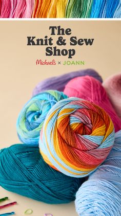 Colorful yarn skeins and knitting supplies on a light background