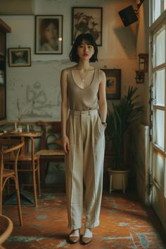 Woman with short hair and red lipstick in a cafe