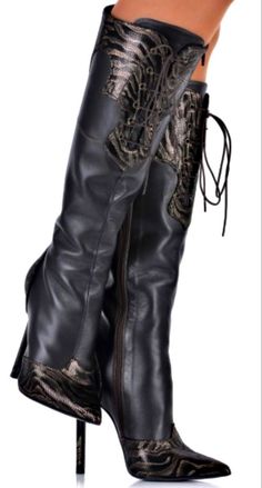 Pair of black leather knee-high boots with animal print details and high heels