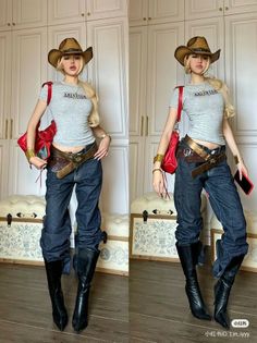 Woman in a cowboy hat, crop top, jeans, and black boots posing indoors