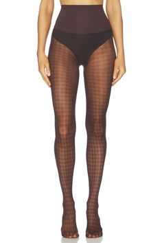 Person wearing houndstooth pattern tights and high-waisted underwear