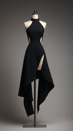 Black halter neck dress with cut-outs and a high slit on a mannequin