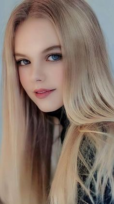 Young woman with long blonde hair and blue eyes in a close-up portrait