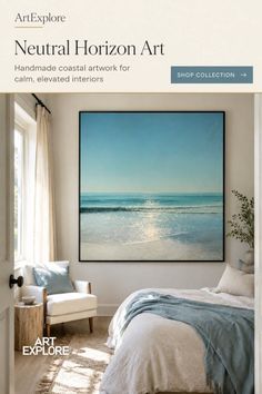 Bedroom with a large beach painting above the bed and an armchair by the window