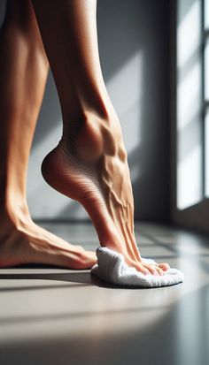 Close up of bare feet on a white towel with dramatic lighting