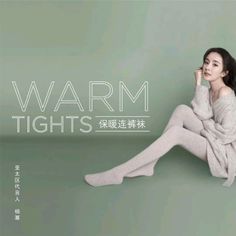 Woman in an off-shoulder sweater and tights sitting in a studio