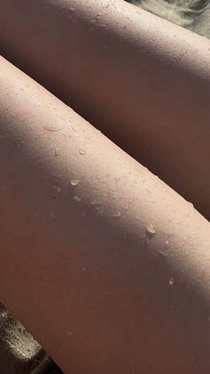 Close up of wet skin with water droplets in warm sunlight