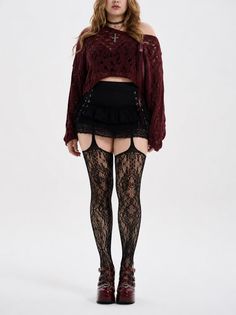 Woman in gothic-style clothing with lace stockings and a cropped sweater