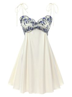 White mini dress with blue floral embroidery and tie spaghetti straps