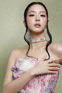 Woman in a pink sequined strapless dress with a choker and jewelry