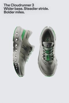 Pair of grey and green running shoes on a white background