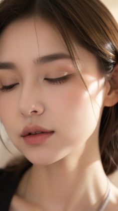 Close up portrait of a woman with closed eyes and soft lighting
