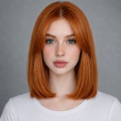 Woman with red hair and green eyes wearing a white t-shirt