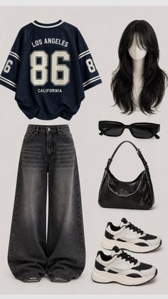 Flat lay of a casual outfit with a varsity shirt and wide leg jeans