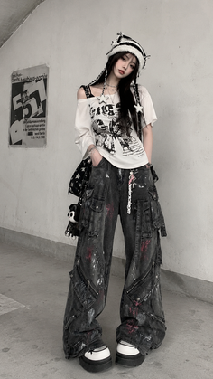 Woman in baggy jeans and a striped hat posing in an urban setting