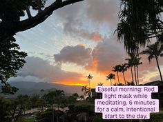 Tropical sunset over mountains and palm trees with a text overlay