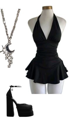 Black halter neck dress with a ruffle skirt, platform heels, and a moon necklace