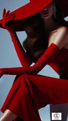Woman in a red dress, wide brim hat, and long gloves