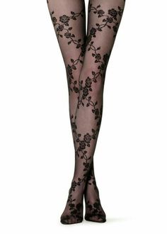 Pair of legs in black sheer stockings with a floral rose pattern