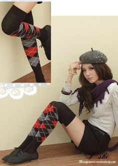Woman in argyle knee-high socks, short skirt, and beret hat sitting indoors