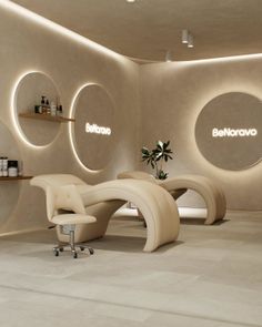 Modern spa room with two treatment beds and indirect lighting