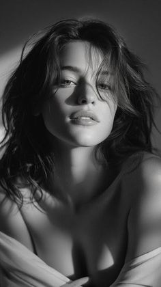 Woman with long hair in dramatic black and white lighting
