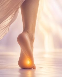 Close up of a foot with a glowing heel and soft lighting