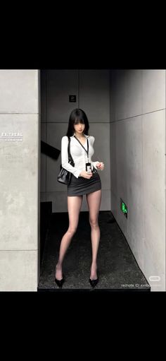Woman in a white shirt and mini skirt posing indoors
