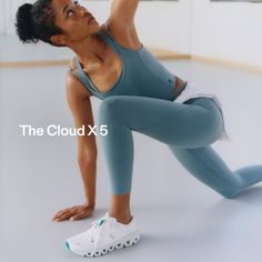 Woman in athletic wear performing a yoga pose in a studio