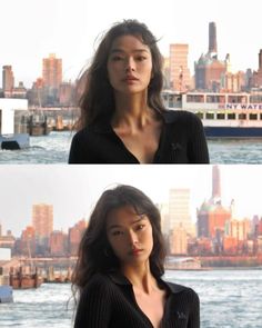 Woman with long dark hair in a black top against a city skyline and water