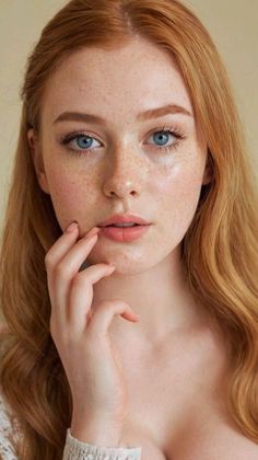 Woman with red hair and blue eyes, with freckles and soft lighting