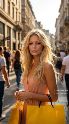 Blonde woman with shopping bags on a sunlit street at golden hour