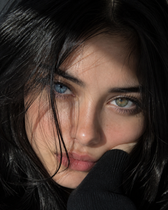 Close up portrait of a person with heterochromia and dark hair