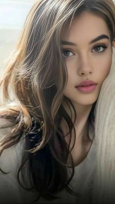 Woman with long brown hair and soft lighting in a portrait shot