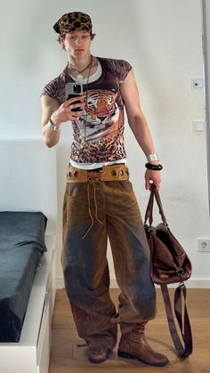Person in a tiger print shirt and baggy pants taking a mirror selfie