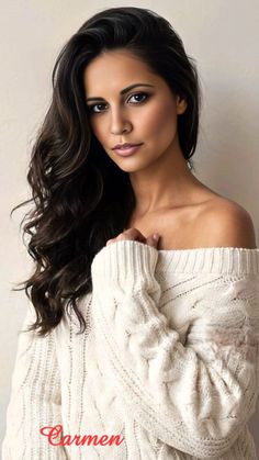 Woman with long dark hair wearing an off-shoulder sweater