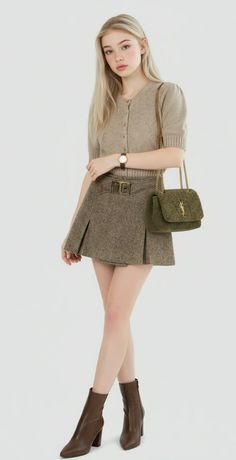Woman with blonde hair wearing a cardigan, mini skirt, and ankle boots