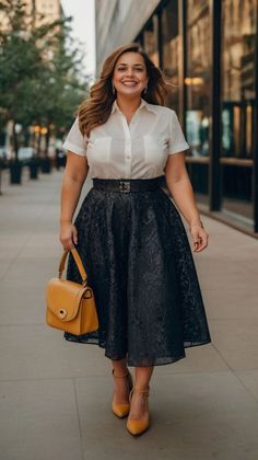 Woman in a white shirt and black skirt walking outdoors with a yellow handbag