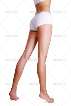 Woman in white underwear with a slim body, full body studio shot