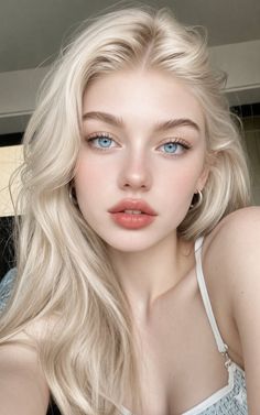 Close-up portrait of a woman with blonde hair and blue eyes