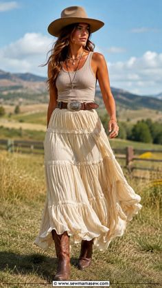 Woman in a cowboy hat and maxi skirt walking outdoors