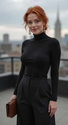 Woman with red hair in a black turtleneck and pants on a rooftop