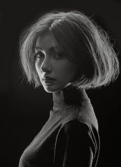 Woman with short hair in a turtleneck, dramatically lit in black and white