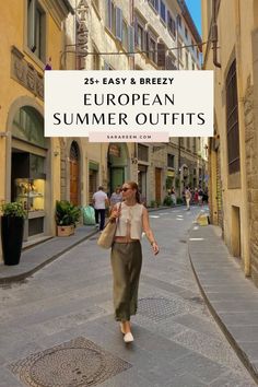 Woman in a crop top and long skirt walking down a narrow street