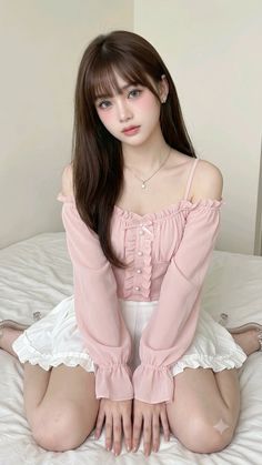 Woman with long hair wearing a pink off-shoulder top and white ruffled skirt