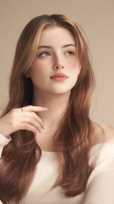 Woman with long light brown hair and an off-shoulder top looking up
