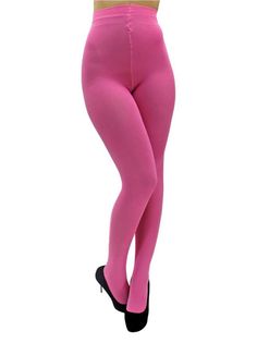 Person wearing bright pink tights and black high heels on a white background
