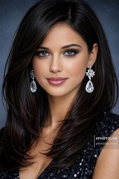 Woman with long dark hair and diamond earrings wearing a sequin dress